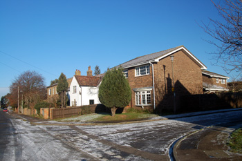 The junction and closest house are on the site of the Wheatsheaf - December 2010